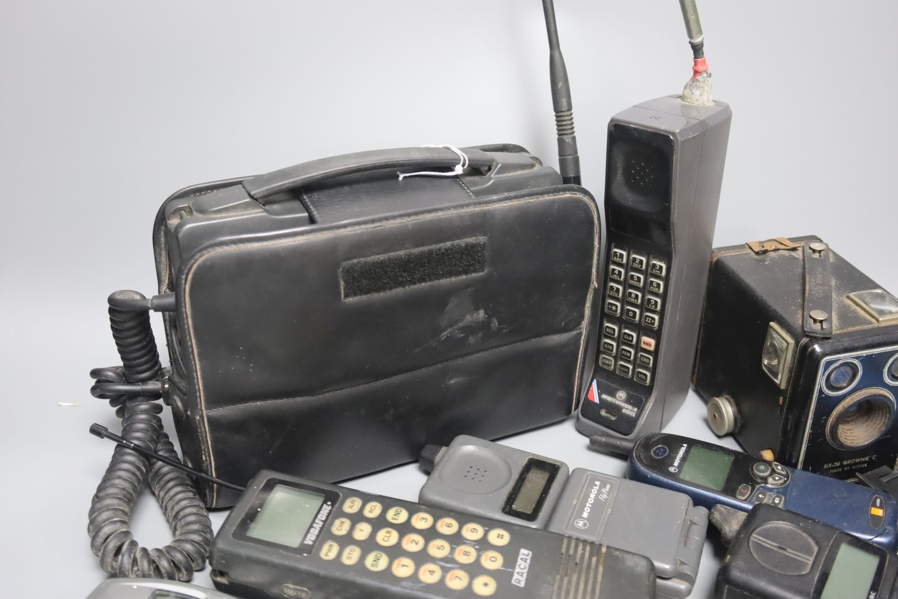 Eight early/retro mobile phones and a Box Brownie